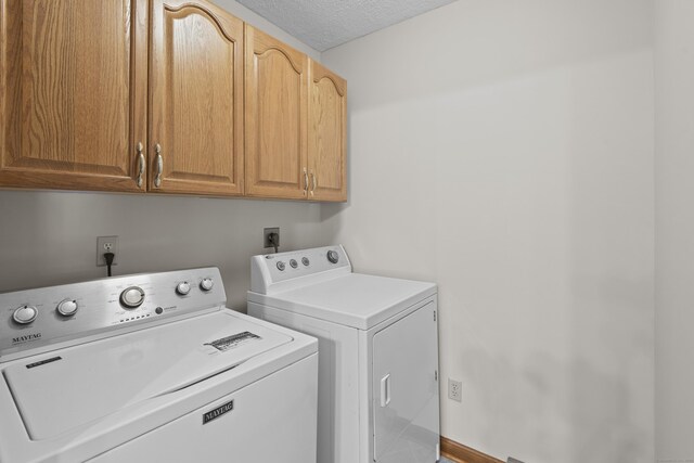 246 Sea Hill Rd, North Branford, CT 06471 - laundry room featuring cabinet space, washer and dryer, and a textured ceiling