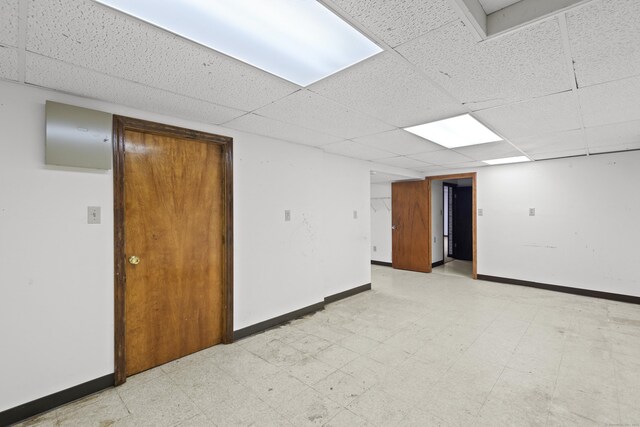 246 Sea Hill Rd, North Branford, CT 06471 - spare room featuring baseboards, a drop ceiling, and light flooring