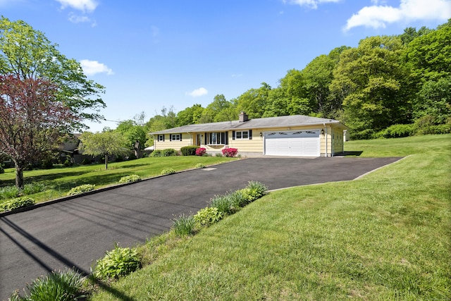 246 Sea Hill Rd, North Branford, CT 06471 - ranch-style home with an attached garage, driveway, a front lawn, and a chimney