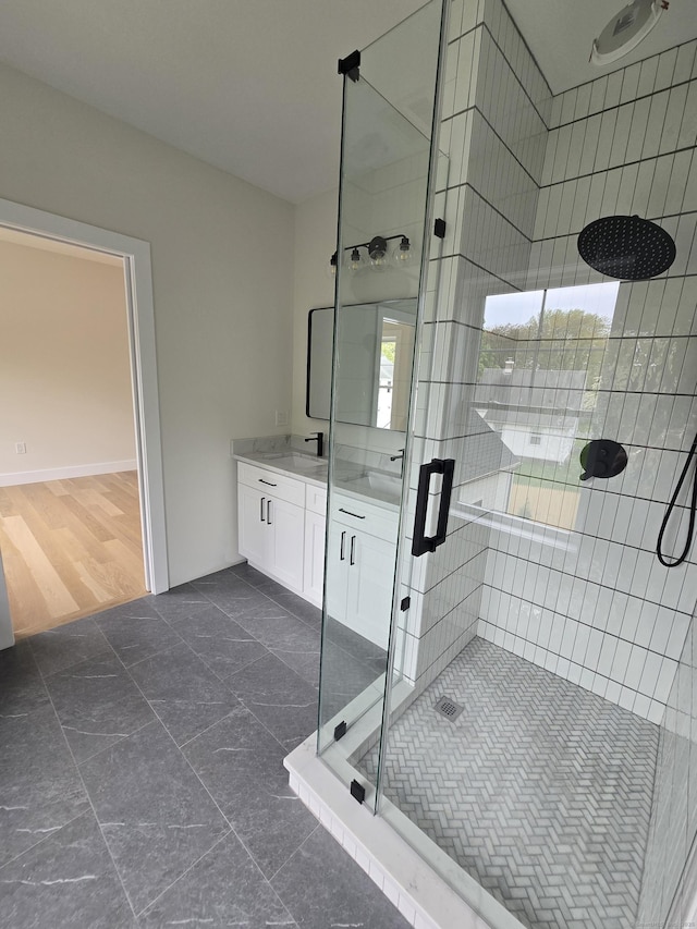 full bathroom with a stall shower and vanity