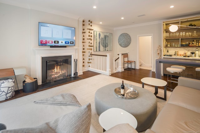 2 Mead St Unit 20, New Canaan, CT 06840 - living area featuring crown molding, stairs, wood finished floors, a glass covered fireplace, and recessed lighting
