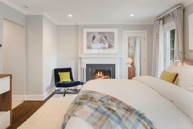 2 Mead St Unit 20, New Canaan, CT 06840 - bedroom with dark wood-style floors, crown molding, recessed lighting, a glass covered fireplace, and baseboards