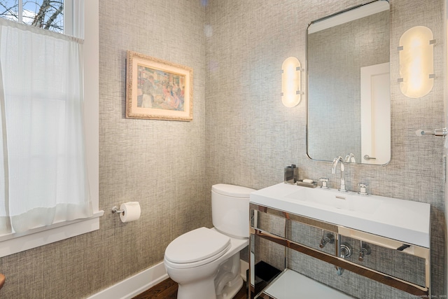 2 Mead St Unit 20, New Canaan, CT 06840 - half bathroom with a sink, toilet, and wood finished floors