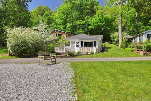 538 Winthrop Rd Unit 5, Deep River, CT 06417 - bungalow-style house featuring a front lawn, a porch, and stone siding