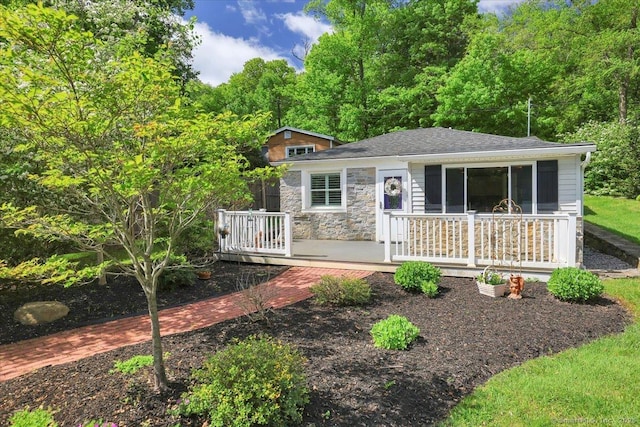 538 Winthrop Rd Unit 5, Deep River, CT 06417 - view of front of house with a wooden deck, stone siding, and a shingled roof