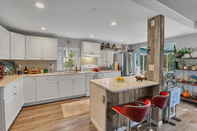 538 Winthrop Rd Unit 5, Deep River, CT 06417 - kitchen with freestanding refrigerator, white electric range oven, light wood-type flooring, light countertops, and recessed lighting