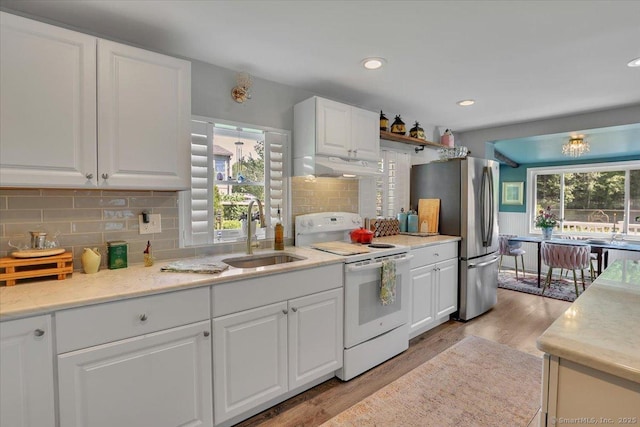 538 Winthrop Rd Unit 5, Deep River, CT 06417 - kitchen featuring white electric range oven, a sink, freestanding refrigerator, light wood-type flooring, and recessed lighting