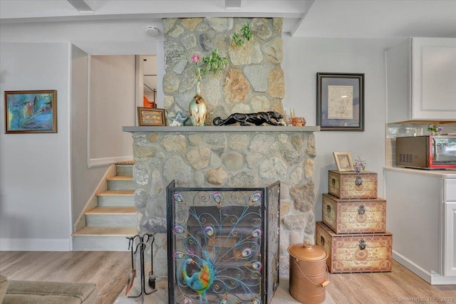 538 Winthrop Rd Unit 5, Deep River, CT 06417 - detailed view of wood finished floors, baseboards, and a fireplace