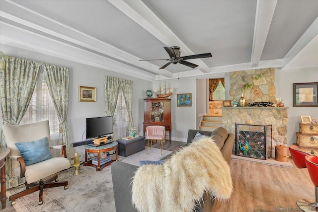 538 Winthrop Rd Unit 5, Deep River, CT 06417 - living area featuring a ceiling fan, beam ceiling, baseboards, wood finished floors, and a stone fireplace