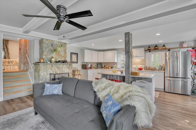 538 Winthrop Rd Unit 5, Deep River, CT 06417 - living room featuring light wood-style flooring, beamed ceiling, recessed lighting, a ceiling fan, and stairway
