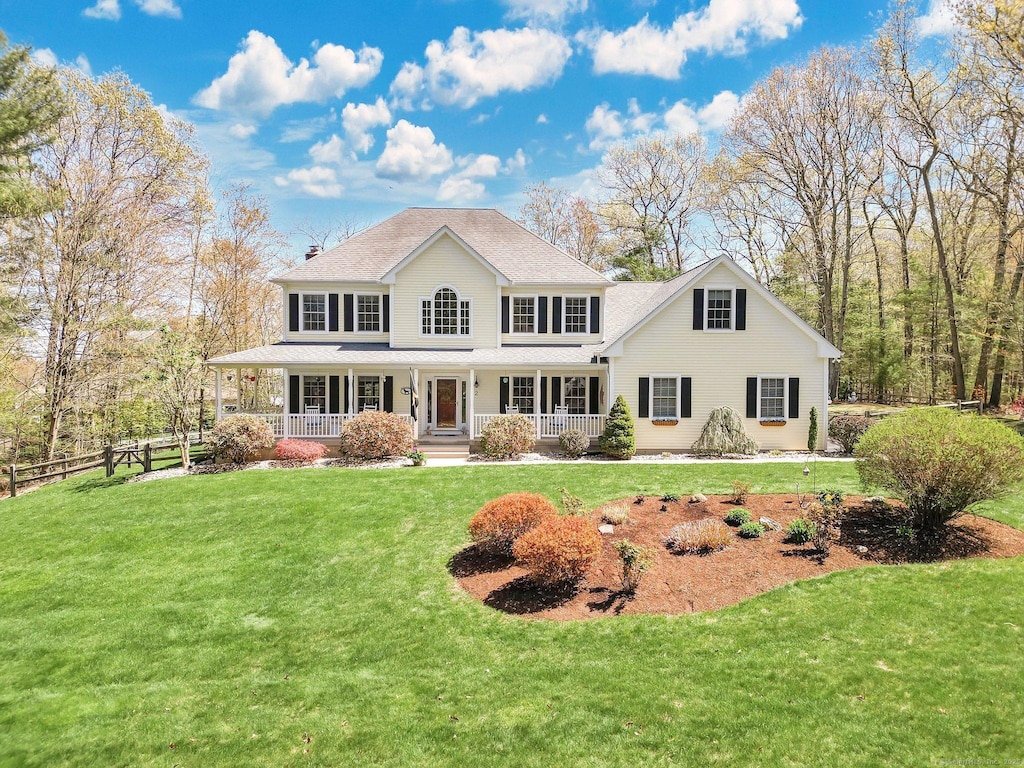 2 Highland Oak Dr, Ellington, CT 06029 - rear view of property with fence, covered porch, a lawn, and roof with shingles