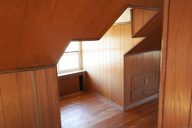 additional living space featuring wooden ceiling, wood walls, and wood finished floors