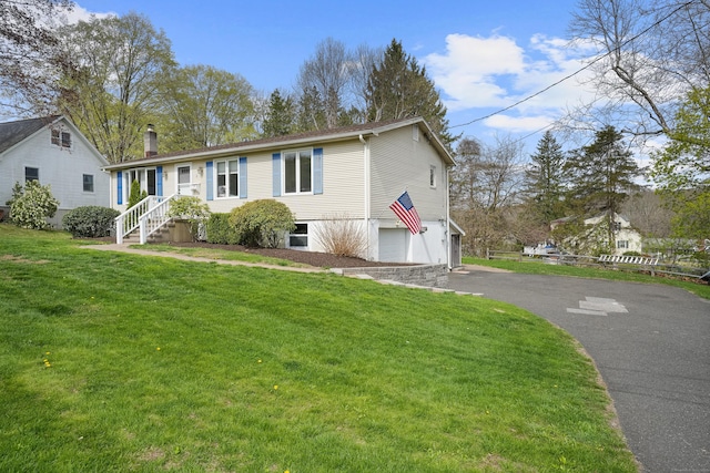 2 Goodhill Rd, New Milford, CT 06776 - view of front of home with a front yard, a chimney, aphalt driveway, and a garage