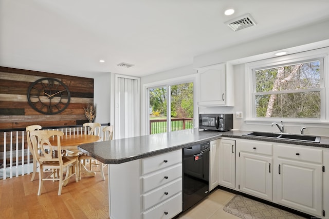 2 Goodhill Rd, New Milford, CT 06776 - kitchen with black appliances, a healthy amount of sunlight, a peninsula, and a sink
