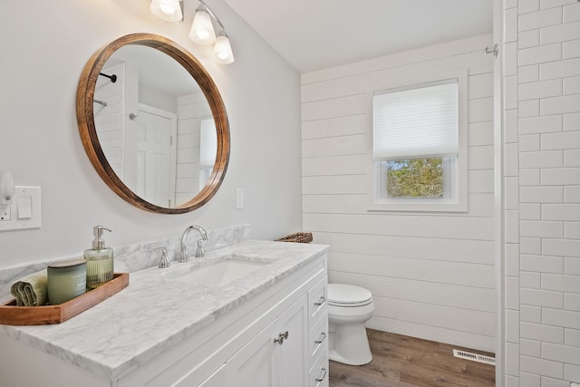 2 Goodhill Rd, New Milford, CT 06776 - bathroom with toilet, vanity, visible vents, and wood finished floors