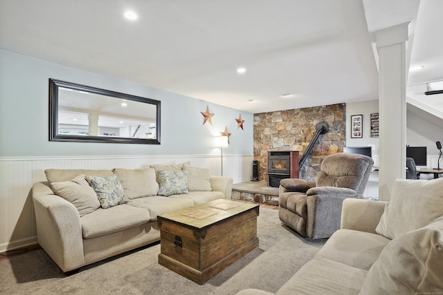 2 Goodhill Rd, New Milford, CT 06776 - living area featuring wainscoting, a wood stove, ornate columns, and recessed lighting