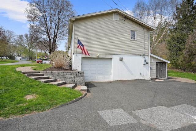 2 Goodhill Rd, New Milford, CT 06776 - view of side of home featuring a garage, driveway, and a lawn