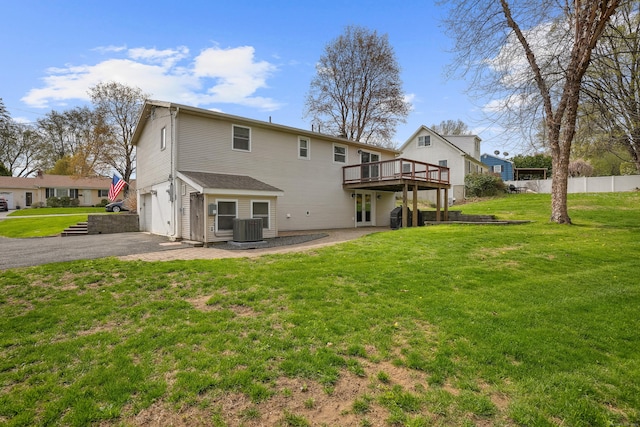 2 Goodhill Rd, New Milford, CT 06776 - rear view of house with fence, aphalt driveway, a wooden deck, cooling unit, and an attached garage