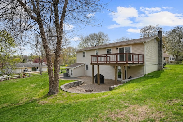 2 Goodhill Rd, New Milford, CT 06776 - rear view of house featuring a chimney, a deck, a patio, central AC unit, and a lawn