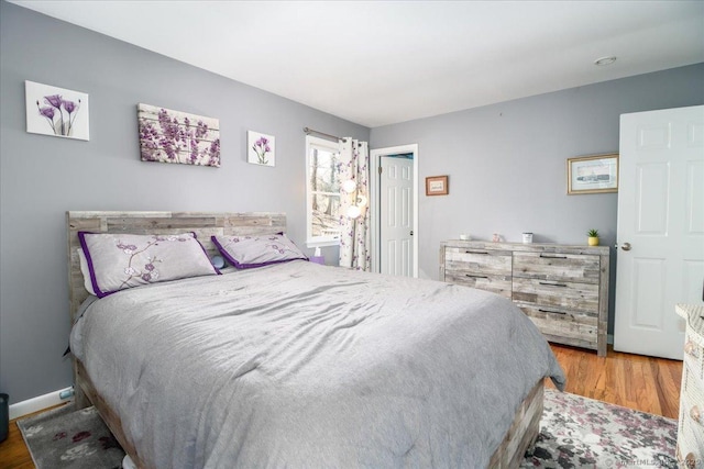 bedroom with wood finished floors