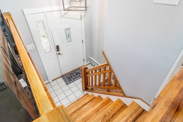 tiled entryway with baseboards