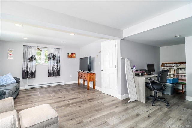 living room with recessed lighting, wood finished floors, baseboards, and baseboard heating