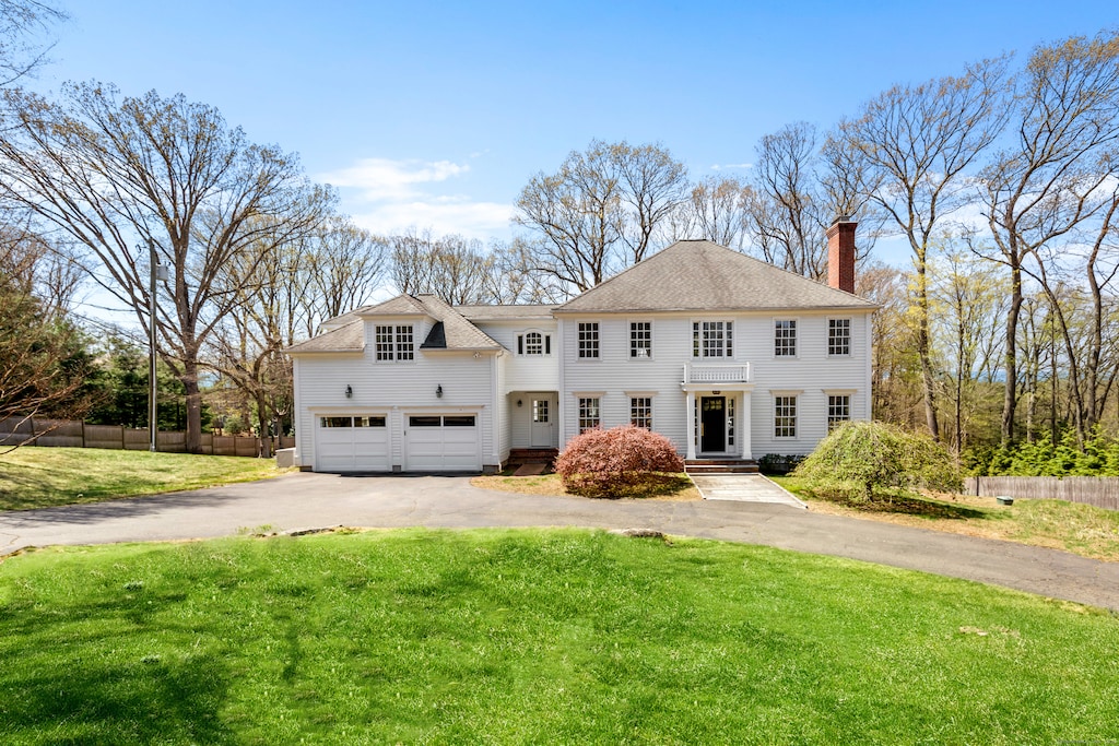 75 Old Hill Rd, Westport, CT 06880 - view of front facade with a chimney, asphalt driveway, and a shingled roof