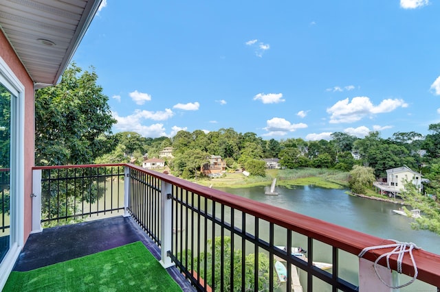 balcony featuring a water view