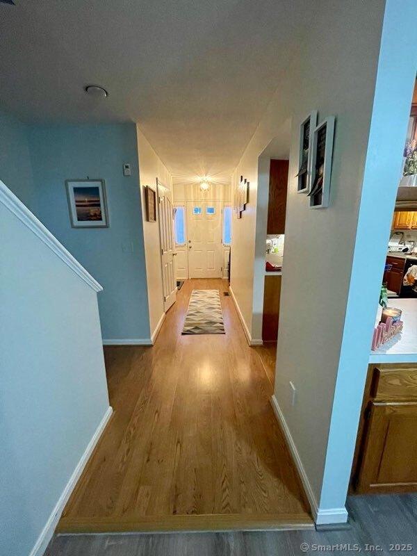 190 Main St Apt D, Manchester, CT 06042 - corridor featuring baseboards and wood finished floors