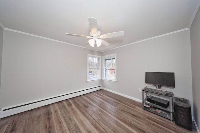 unfurnished living room featuring crown molding, a baseboard heating unit, baseboards, wood finished floors, and a ceiling fan