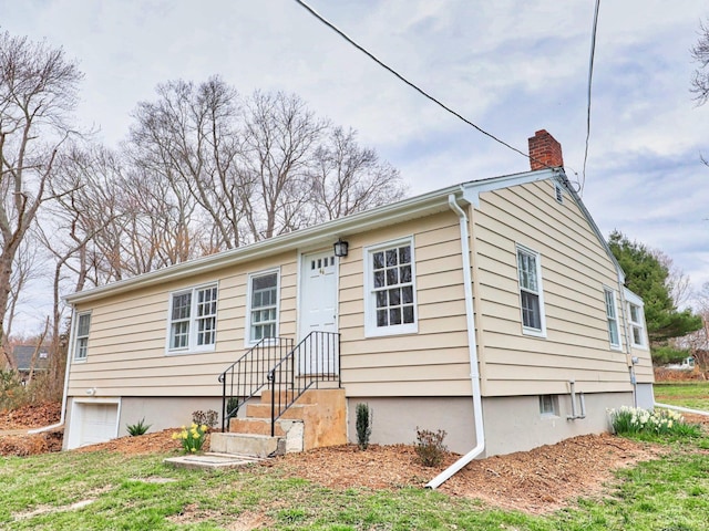 46 Sperry Dr, Guilford, CT 06437 - ranch-style house featuring a chimney and a garage