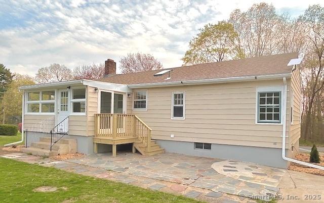 46 Sperry Dr, Guilford, CT 06437 - back of property featuring a chimney and a patio