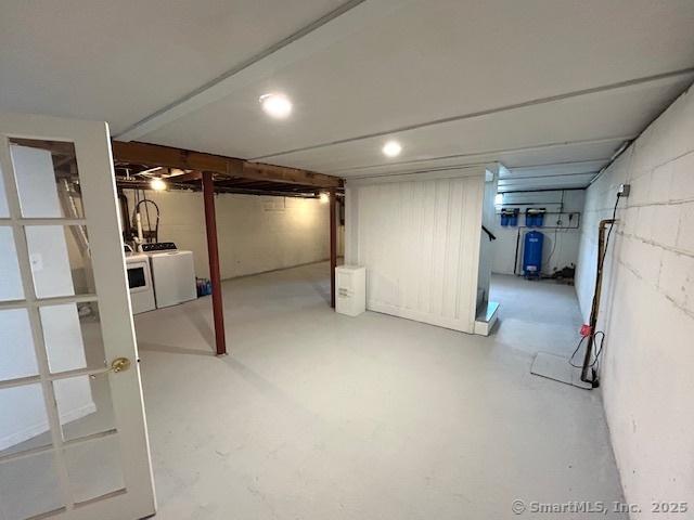 46 Sperry Dr, Guilford, CT 06437 - finished below grade area with washer and dryer and a water pressure tank