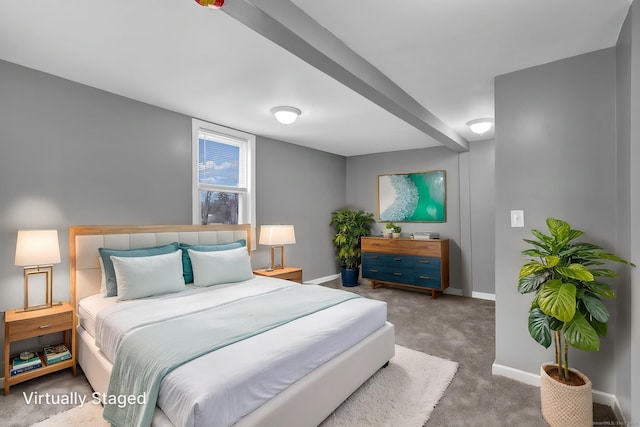 carpeted bedroom featuring baseboards