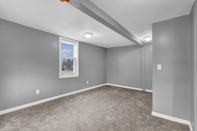 below grade area featuring baseboards and carpet flooring