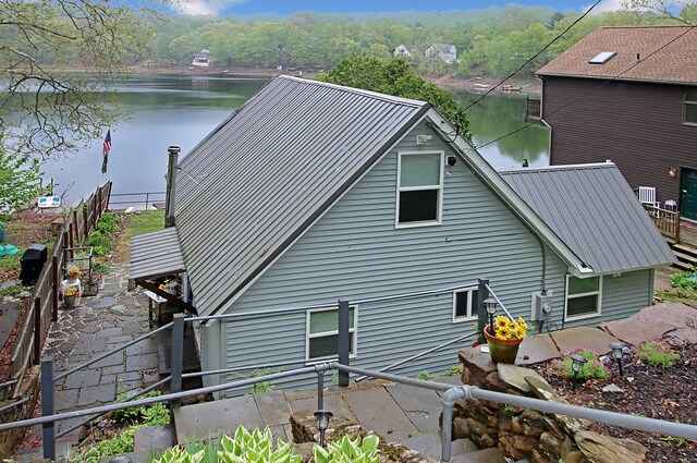 60 Jobs Gate Unit 2, Portland, CT 06480 - view of home's exterior featuring metal roof, a water view, and fence
