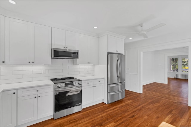 34 Power House Rd, Montville, CT 06382 - kitchen with stainless steel appliances, recessed lighting, radiator heating unit, decorative backsplash, and light countertops