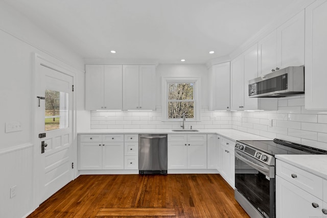 34 Power House Rd, Montville, CT 06382 - kitchen with white cabinetry, dark wood-style floors, stainless steel appliances, and a sink