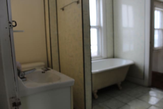 15 Wall St, Middletown, CT 06457 - bathroom with tile patterned floors, a freestanding tub, and vanity