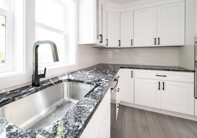 43 Moose Hill Rd, Trumbull, CT 06611 - kitchen with a sink, healthy amount of natural light, white cabinetry, and dark stone countertops