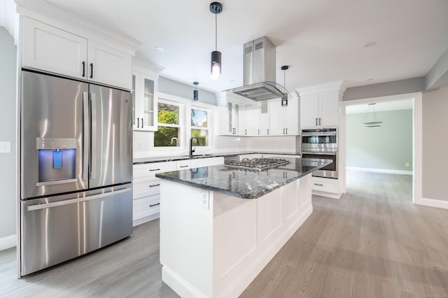 43 Moose Hill Rd, Trumbull, CT 06611 - kitchen with stainless steel appliances, island range hood, light wood-type flooring, a sink, and glass insert cabinets