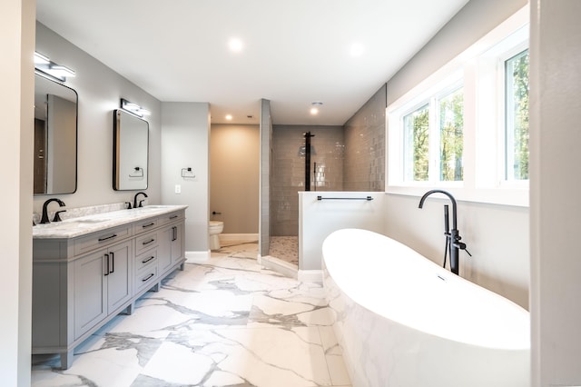 43 Moose Hill Rd, Trumbull, CT 06611 - bathroom featuring double vanity, marble tiled floors, a soaking tub, toilet, and tiled shower