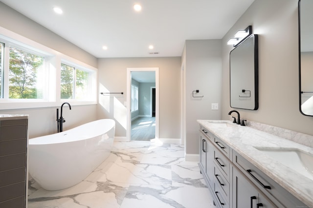 43 Moose Hill Rd, Trumbull, CT 06611 - bathroom featuring double vanity, a freestanding bath, recessed lighting, baseboards, and marble finish floors