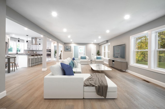 43 Moose Hill Rd, Trumbull, CT 06611 - living area featuring recessed lighting, light wood finished floors, plenty of natural light, and baseboards
