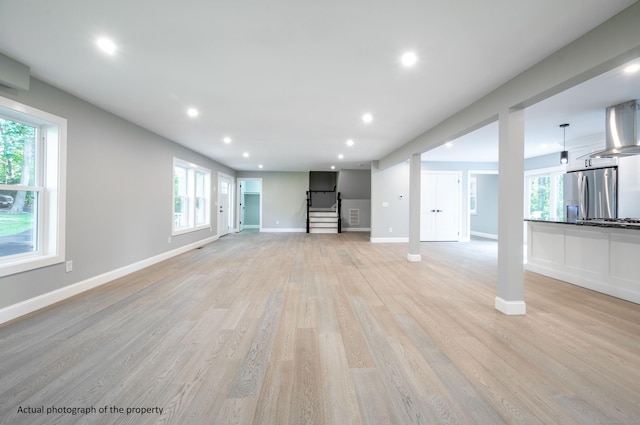 43 Moose Hill Rd, Trumbull, CT 06611 - unfurnished living room featuring baseboards, light wood-style flooring, healthy amount of natural light, and recessed lighting