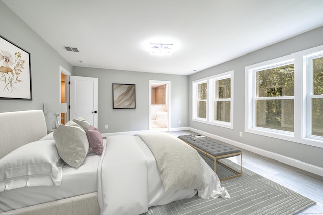 43 Moose Hill Rd, Trumbull, CT 06611 - bedroom featuring baseboards, wood finished floors, and connected bathroom