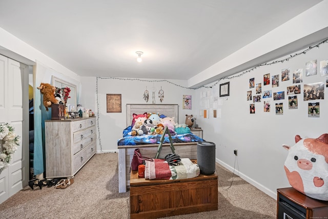 bedroom with baseboards and light carpet