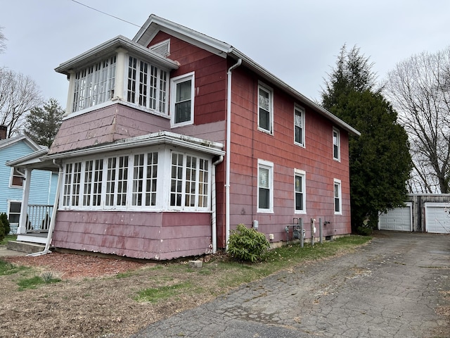 21-23 Elm St, Derby, CT 06418 - view of property exterior featuring a garage and an outbuilding