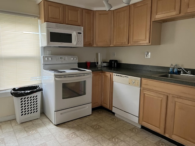 21-23 Elm St, Derby, CT 06418 - kitchen featuring a sink, dark countertops, a healthy amount of sunlight, and white appliances