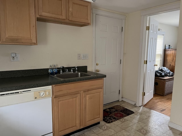 21-23 Elm St, Derby, CT 06418 - kitchen featuring dark countertops, a sink, white dishwasher, and baseboards